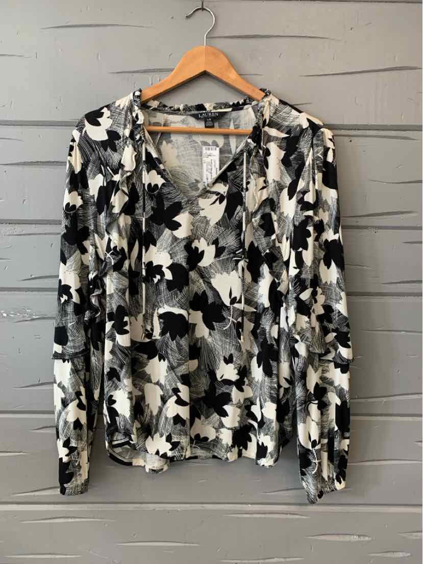 Black and white floral long-sleeve Ralph Lauren blouse with V-neck hanging on wooden hanger.