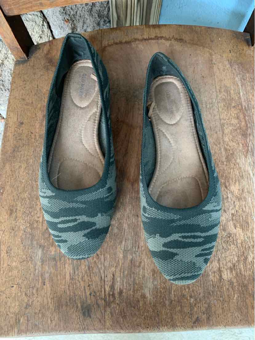 Green and black camo print ballet flats with rounded square toes and cushioned insoles.
