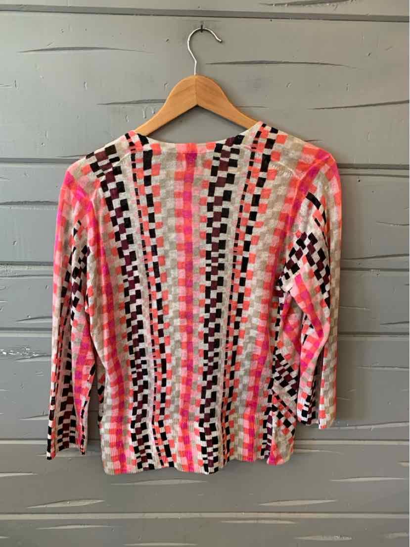 Pink, black, and white patterned long-sleeve knit top with geometric design, medium size.
