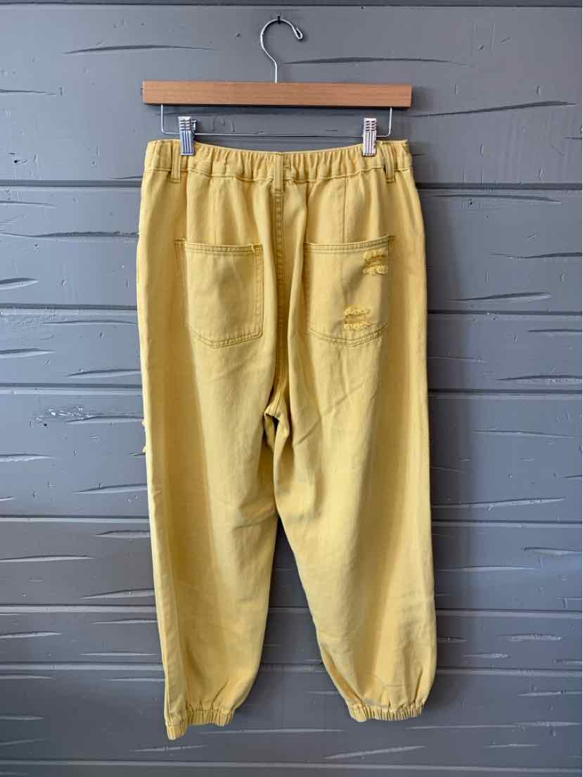Yellow elastic waist pants with back patch pockets and gathered cuffs in small size.