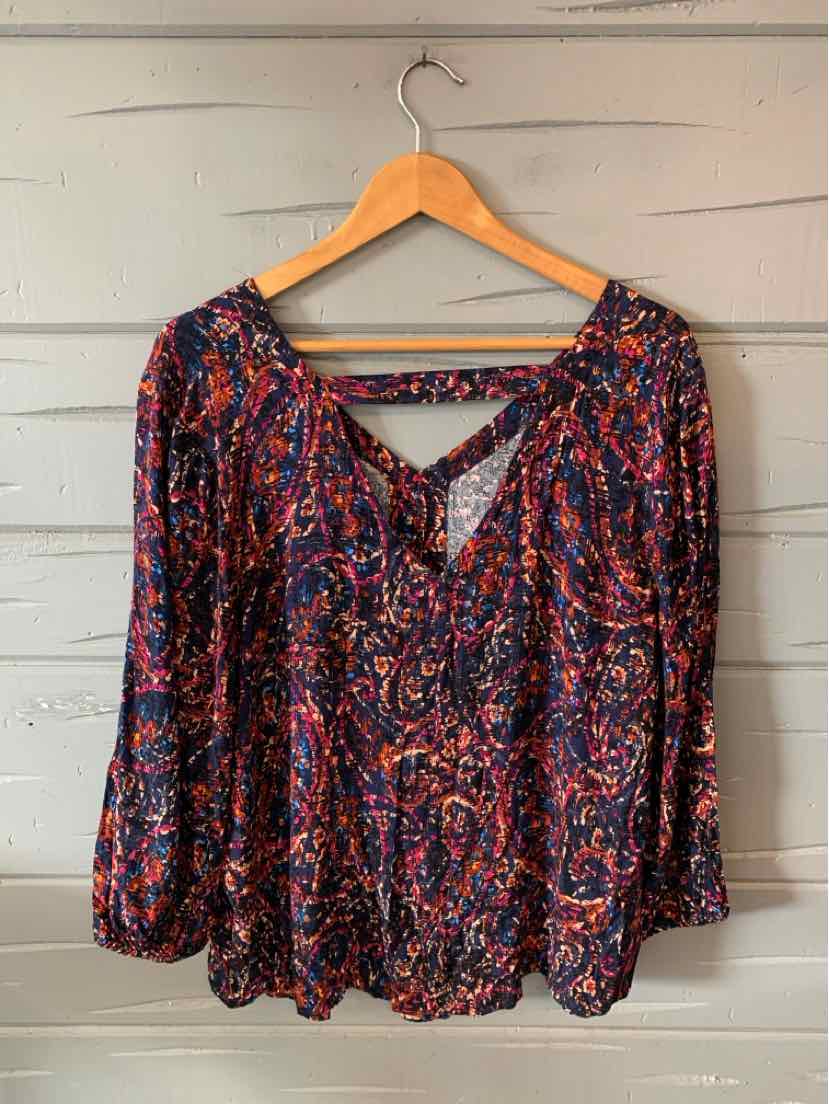 Long-sleeve blouse with vibrant multicolor abstract pattern, deep V-neck with crisscross strap detail, loose fit in XL size.