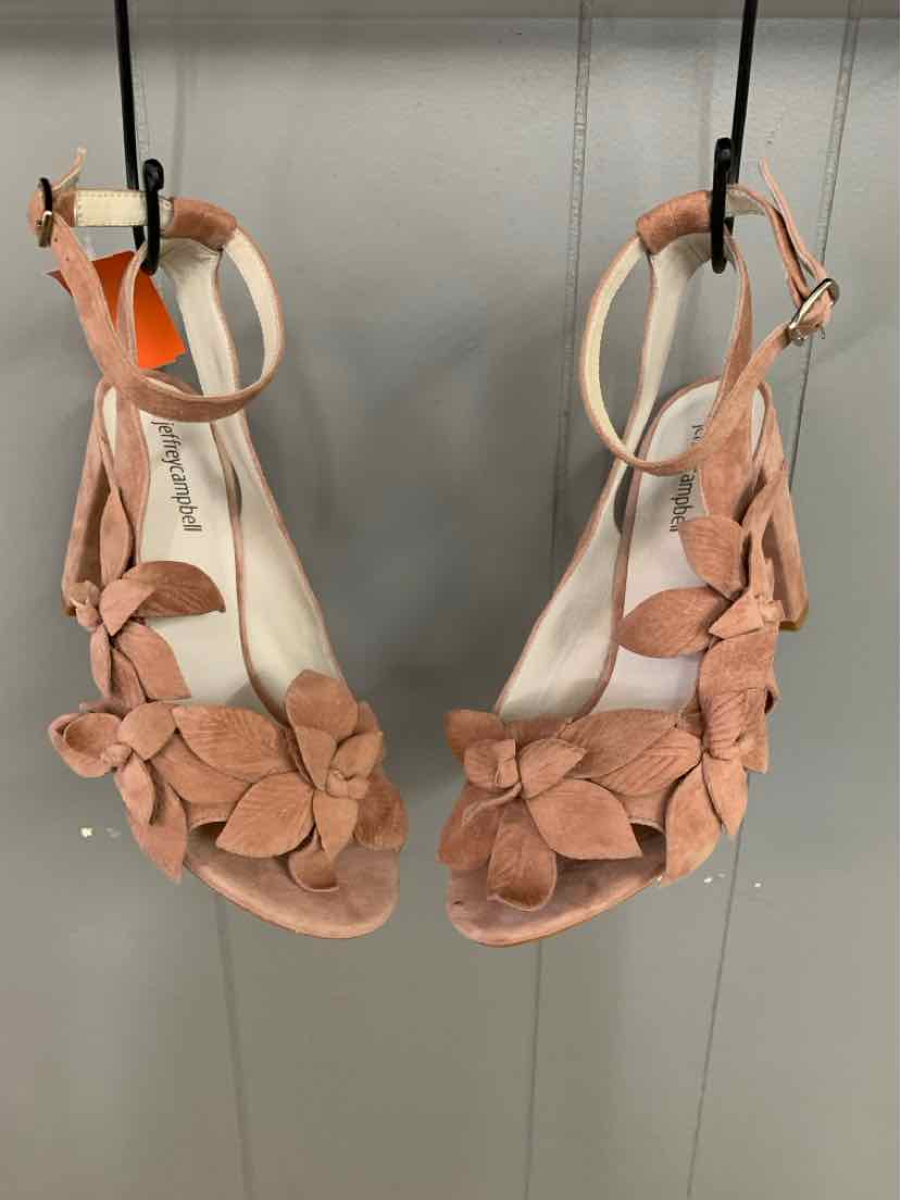 Tan suede open-toe sandals with floral embellishments and ankle straps, size 9.5.