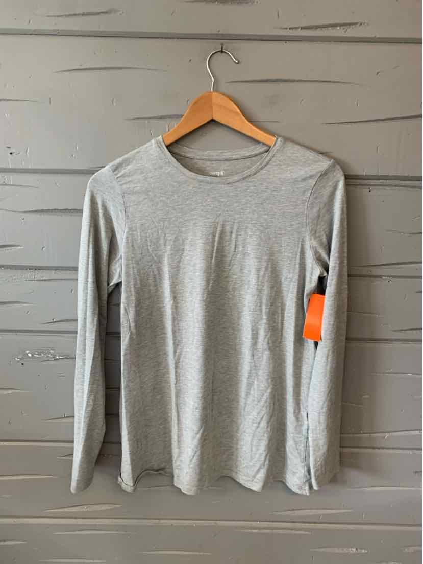 Light gray long-sleeve crew neck shirt with simple, slim fit and soft fabric, hanging on wooden hanger.