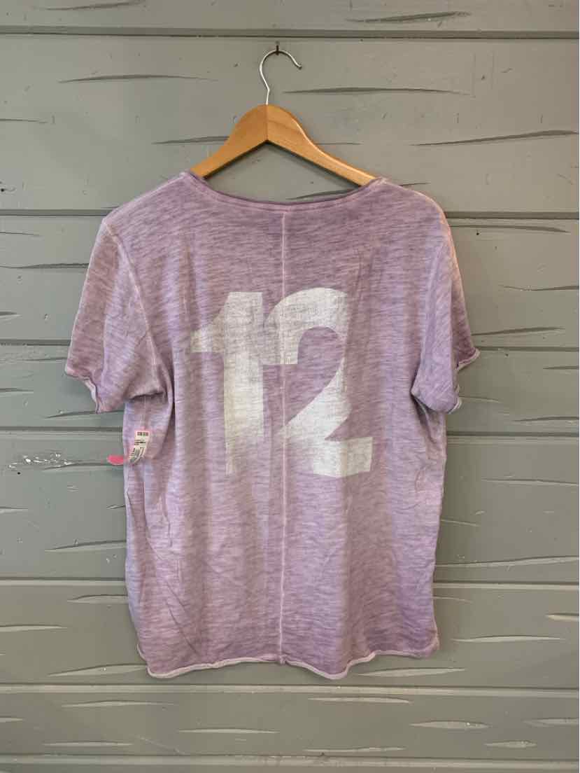 Light purple short-sleeve t-shirt with large white number 12 on the back, hanging on wooden hanger.