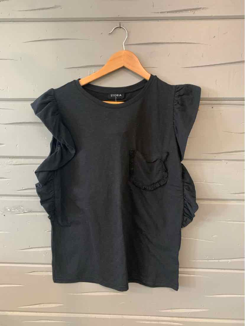 Black short-sleeve top with ruffled shoulders and small chest pocket on wooden hanger.