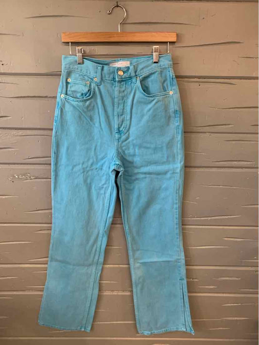 Light blue high-waisted denim jeans with front pockets and button fly, size 6.