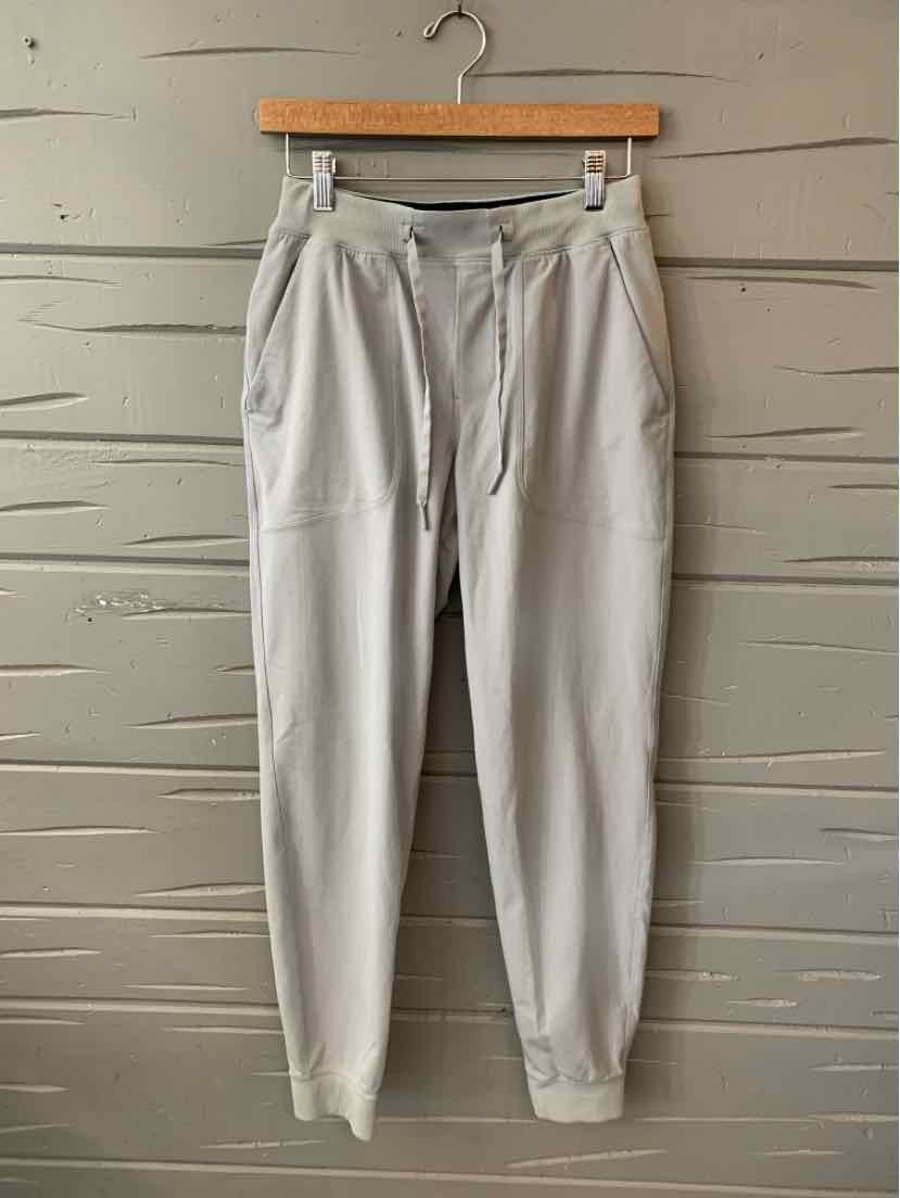 Light gray Lululemon jogger pants with tapered legs, drawstring waist, and side pockets.
