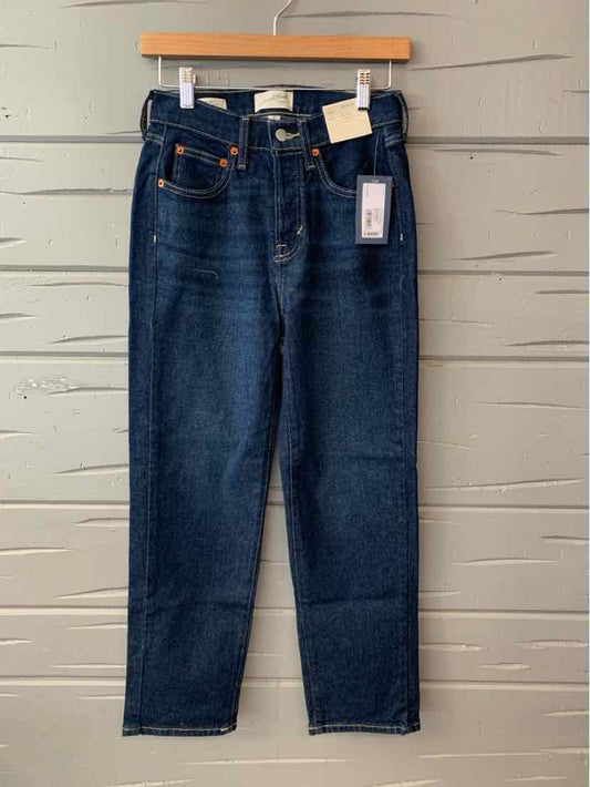 Dark blue high-waisted straight-leg denim jeans with five-pocket design and orange stitching.