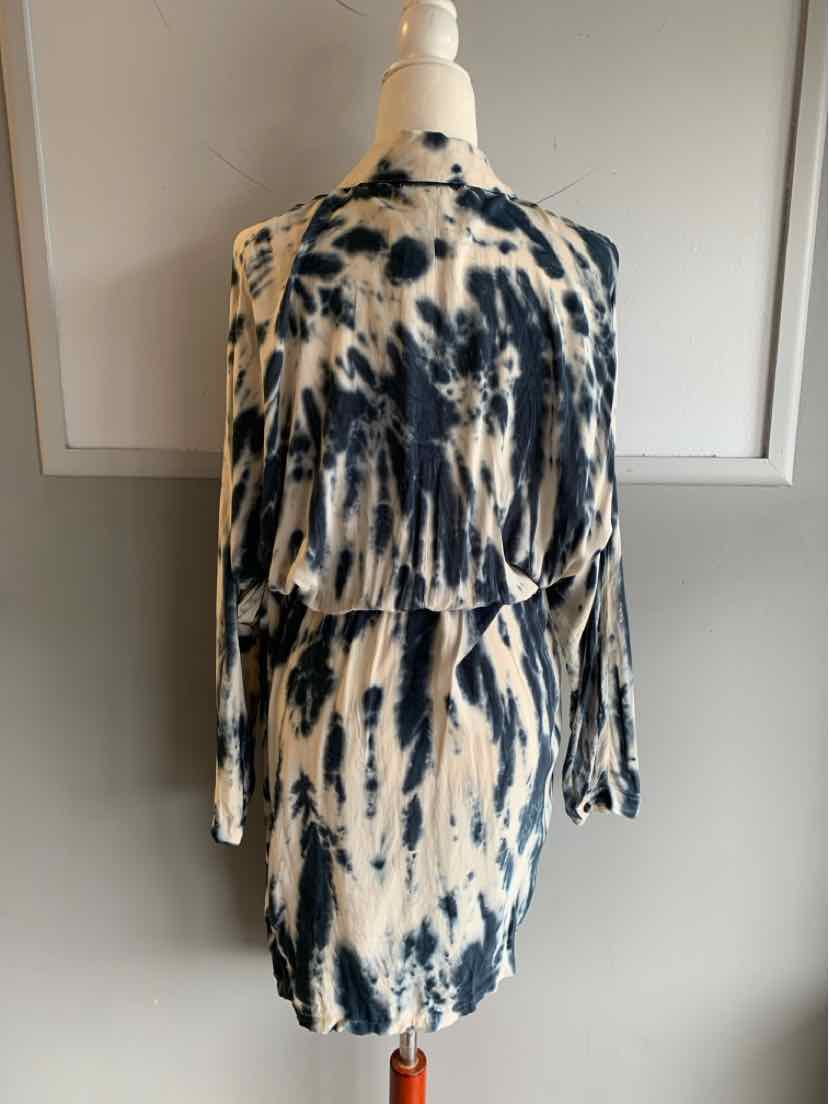 Black and white tie-dyed long sleeve dress with loose fit and dropped waist detail.