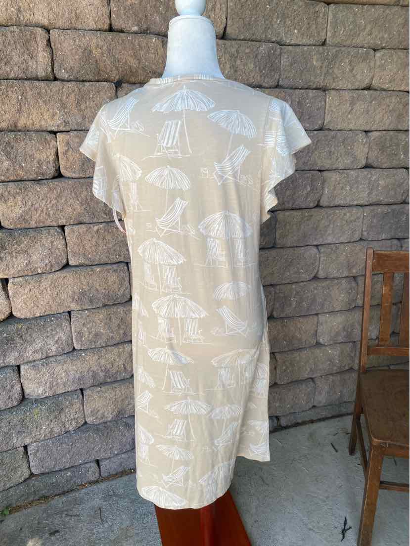 Tan midi dress with short flutter sleeves and white seashell print on lightweight fabric.
