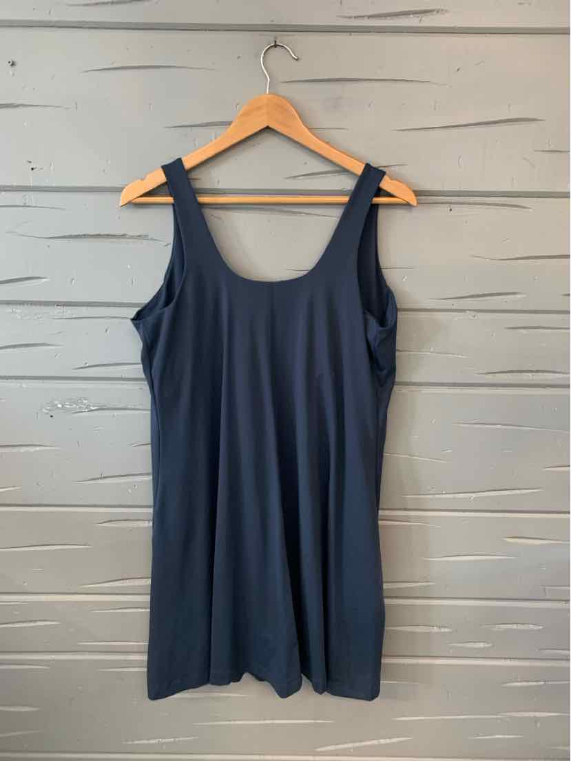 Navy blue sleeveless dress with scoop neckline in size XL, hanging on wooden hanger.