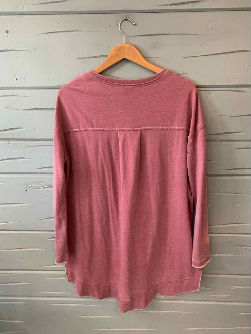 Maroon long-sleeve soft knit top with relaxed fit and seam detail across upper back.