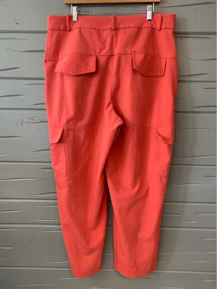 Coral high-waisted tailored trousers with back flap pockets and tapered legs, size 16.
