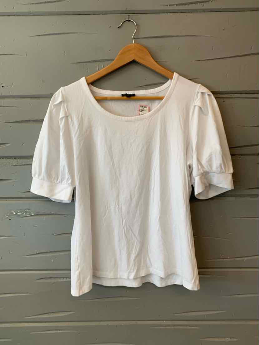 White short-sleeve blouse with puffed sleeves and round neckline on wooden hanger.