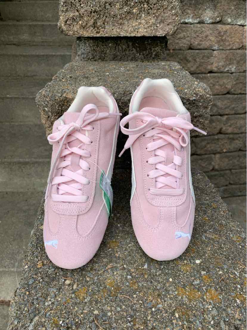 Light pink suede sneakers with white Puma logo and laces, size 6.5 women's style.