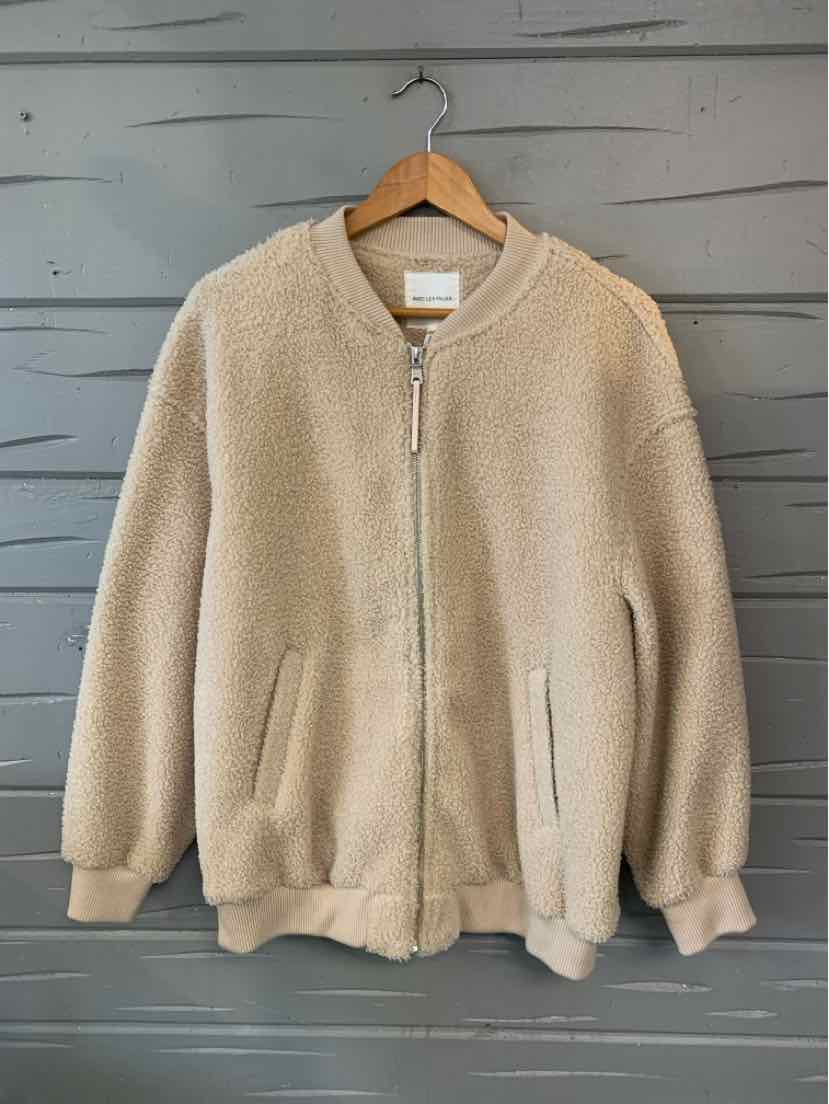 Tan sherpa fleece bomber jacket with a stand collar, front zipper, ribbed cuffs and hem, and side pockets.
