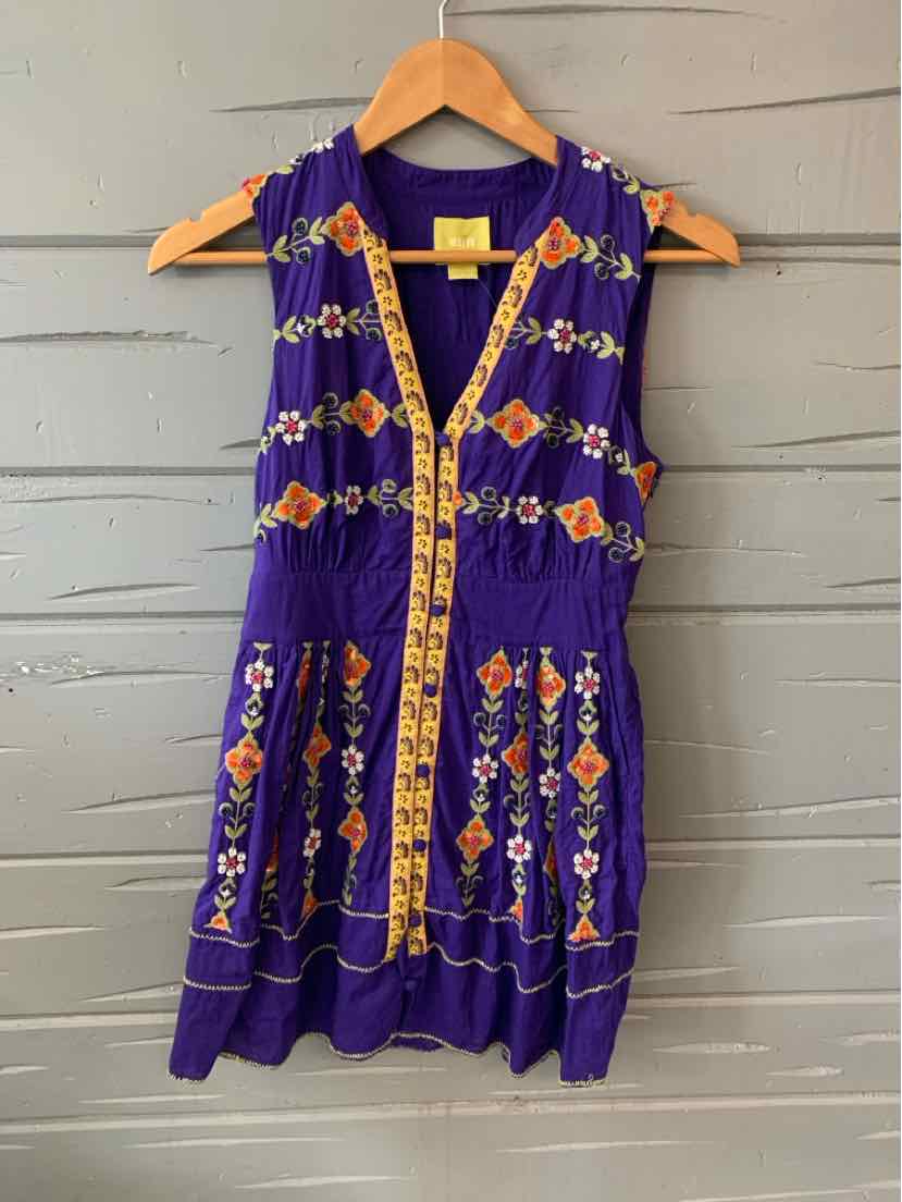 Purple sleeveless dress with orange and yellow floral embroidery and a yellow embroidered trim down the front.