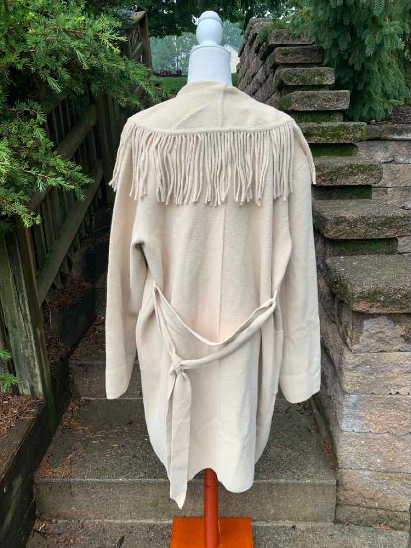 Tan suede coat with long fringe across upper back and waist tie belt, size XL.