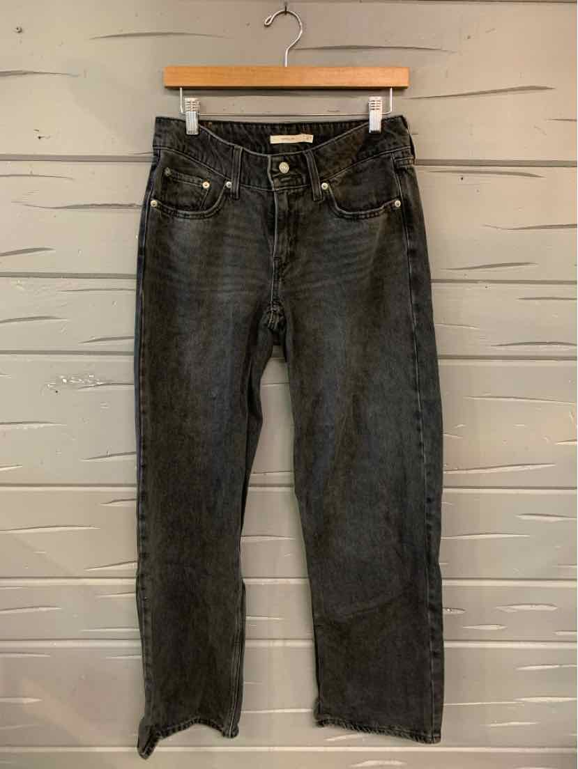 Black straight-leg Levi's denim jeans with classic five-pocket design and visible fading.