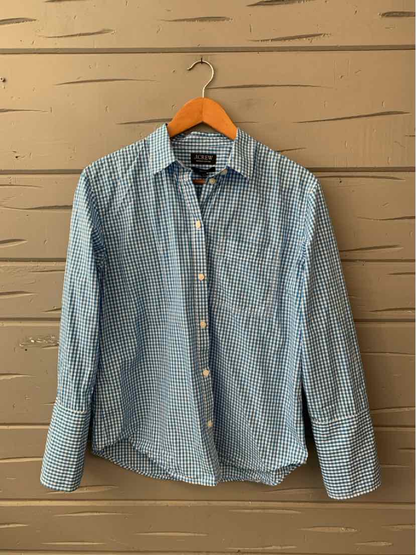 Light blue gingham button-up shirt with long sleeves and a classic collar on a wooden hanger.