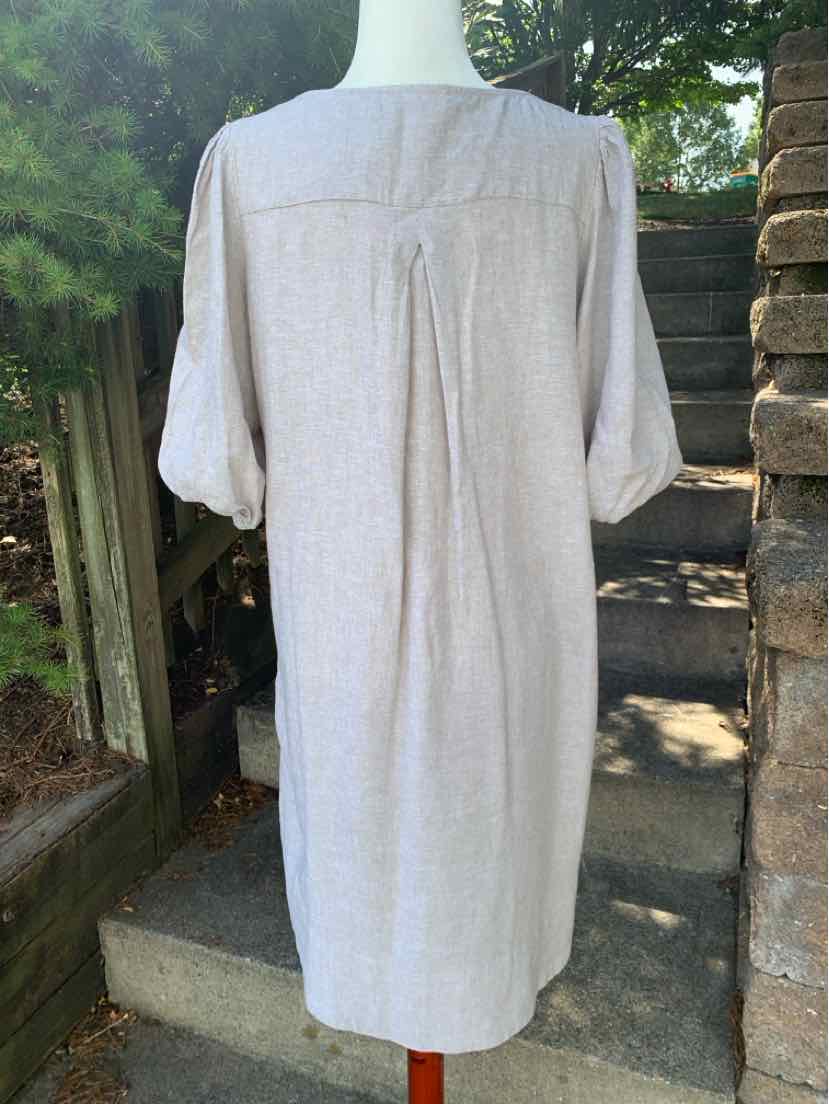 Beige linen knee-length dress with 3/4 sleeves and back pleat detail.