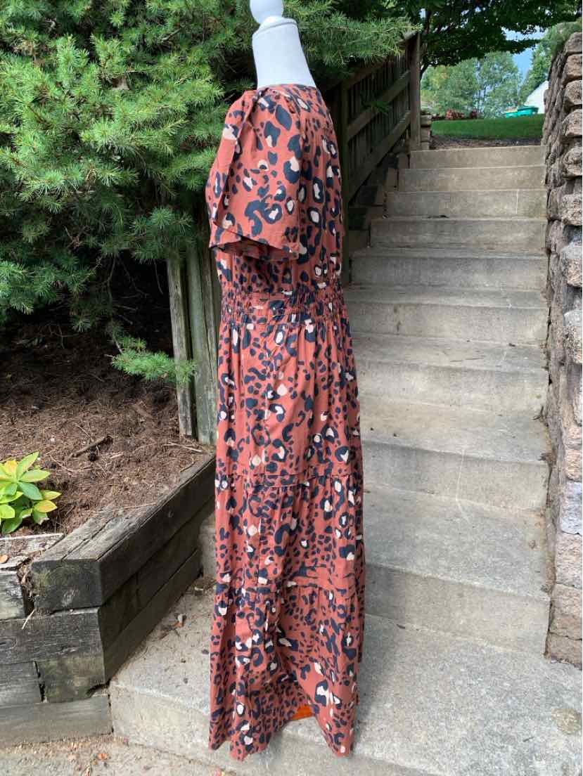 Brown cheetah print maxi dress with short sleeves and relaxed fit.