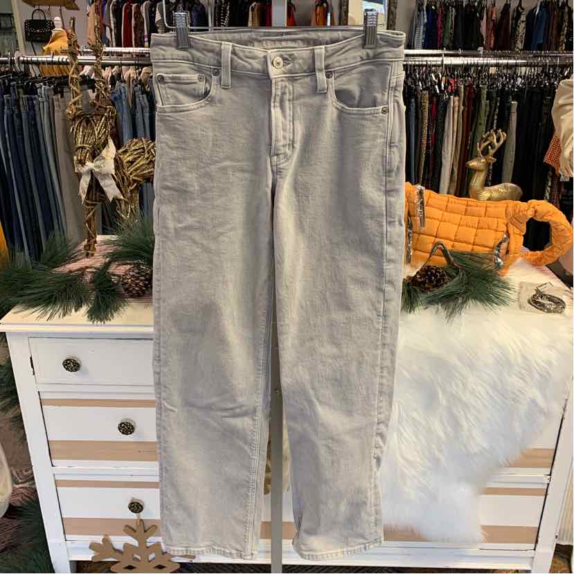 Light gray high-waisted denim jeans with front and back pockets, straight leg cut.