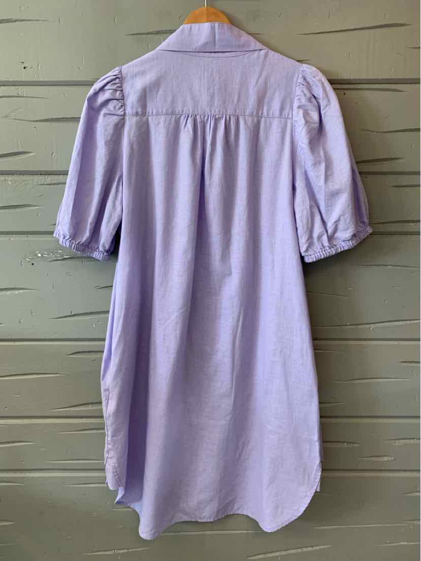 Lavender short-sleeve dress with puffed sleeves and button-up front, knee-length silhouette.