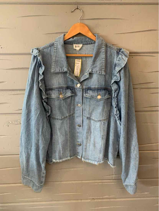 Light blue denim jacket with frayed edges and ruffle details on the shoulders, button front closure, and chest pockets.