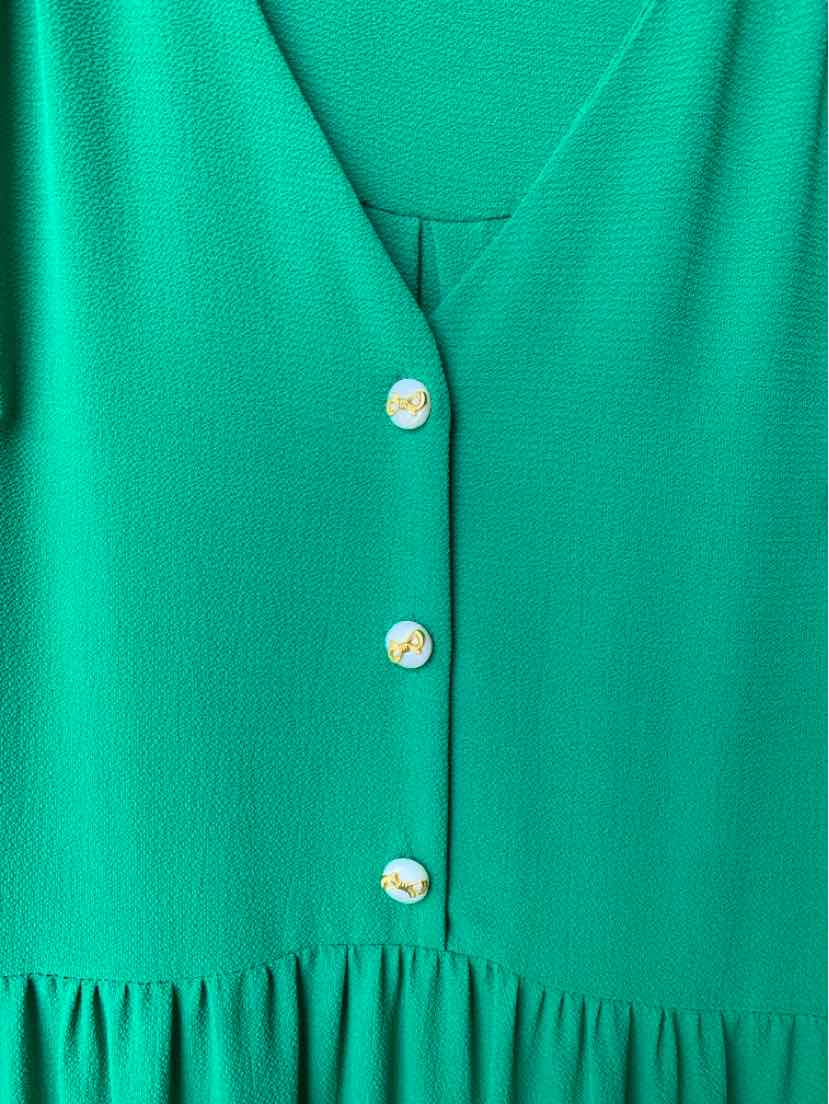 Green dress with V-neckline, three pearl-like buttons, and gathered waist detail.