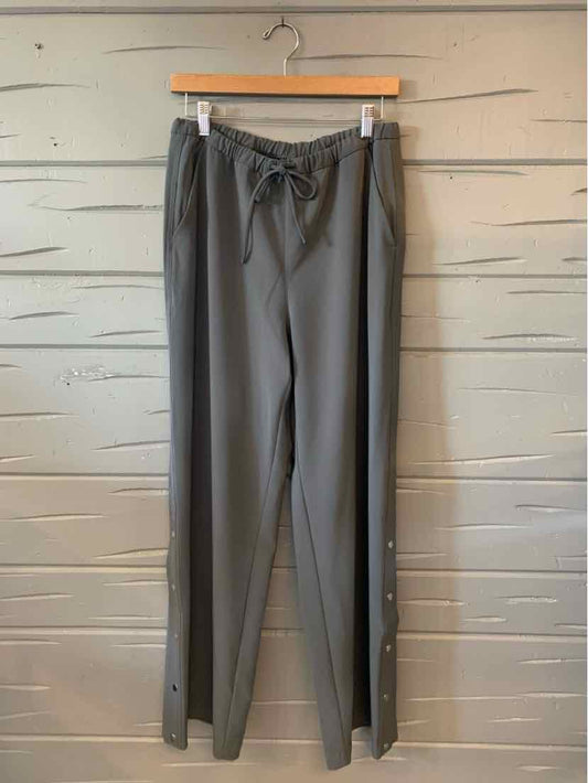 Gray Athleta women's athletic pants with a drawstring waist, straight legs, and side pockets.