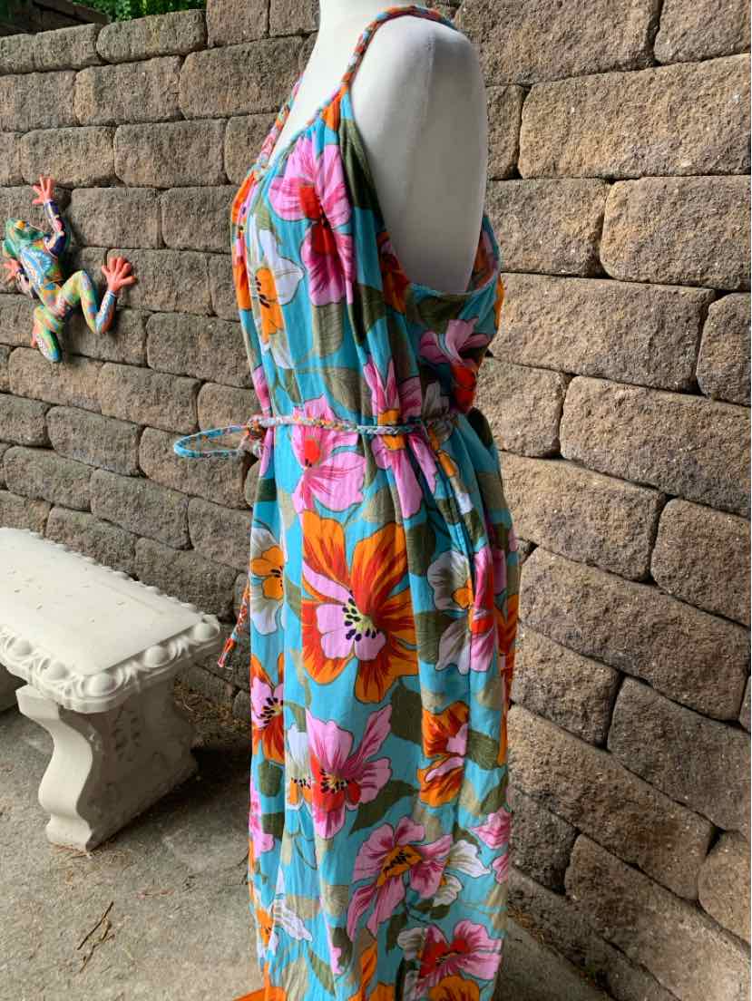Sleeveless tropical print maxi dress with pink and orange flowers on blue background, elastic waist.