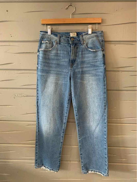 Light blue distressed denim jeans with frayed hems and classic five-pocket styling.