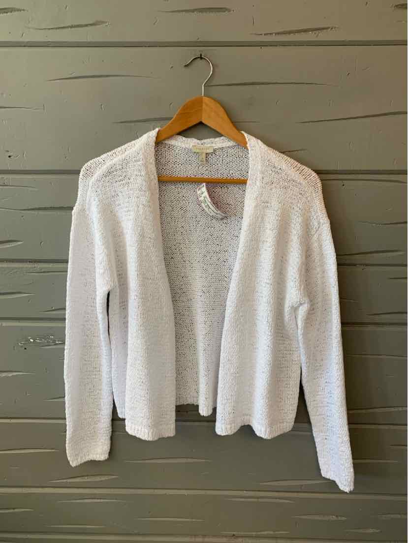 White open-front knit cardigan with long sleeves and textured fabric hanging on wooden hanger.