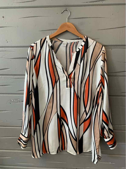 Long-sleeve blouse with abstract orange, black, and beige geometric patterns on white background.