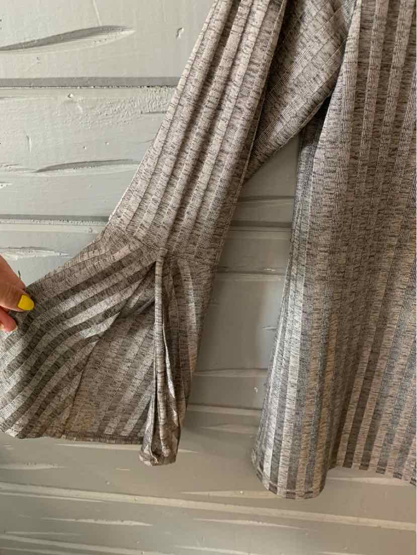 Gray medium knit sweater with vertical ribbing and flared sleeves featuring a slit detail.