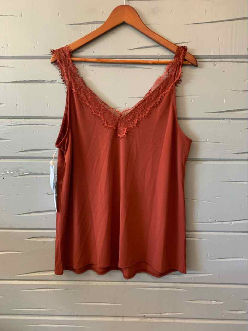 Orange sleeveless women's casual top with lace trim neckline on wooden hanger.