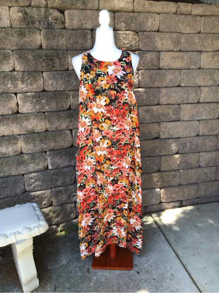 Sleeveless floral maxi dress in warm orange, red, and yellow tones with a scoop neckline and flowing silhouette.