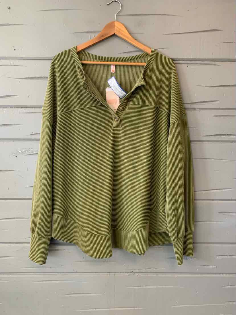 Olive green women’s long-sleeve knit top with a V-neck and button placket, hanging on a wooden hanger.