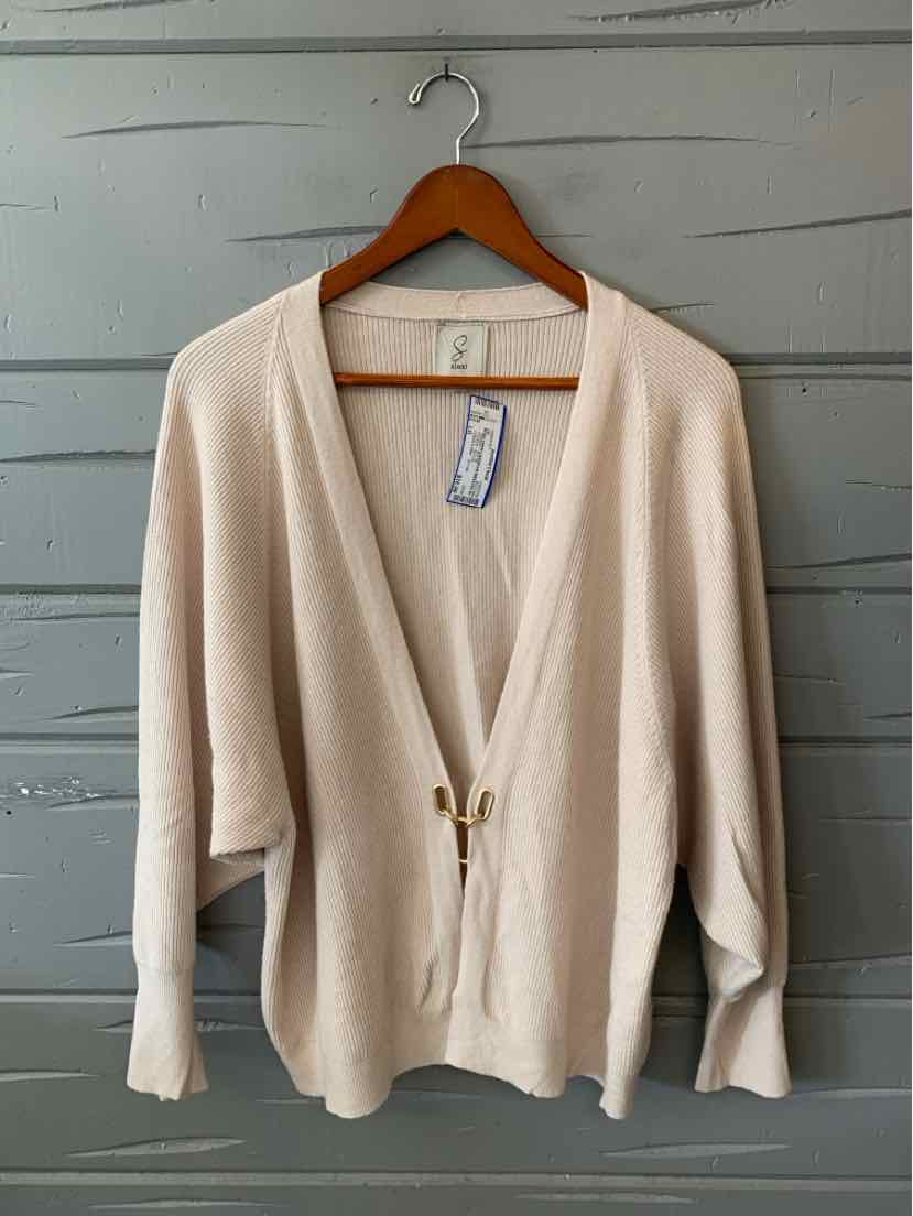 Beige women's cardigan with an open V-neck, long sleeves, and a single-button closure.