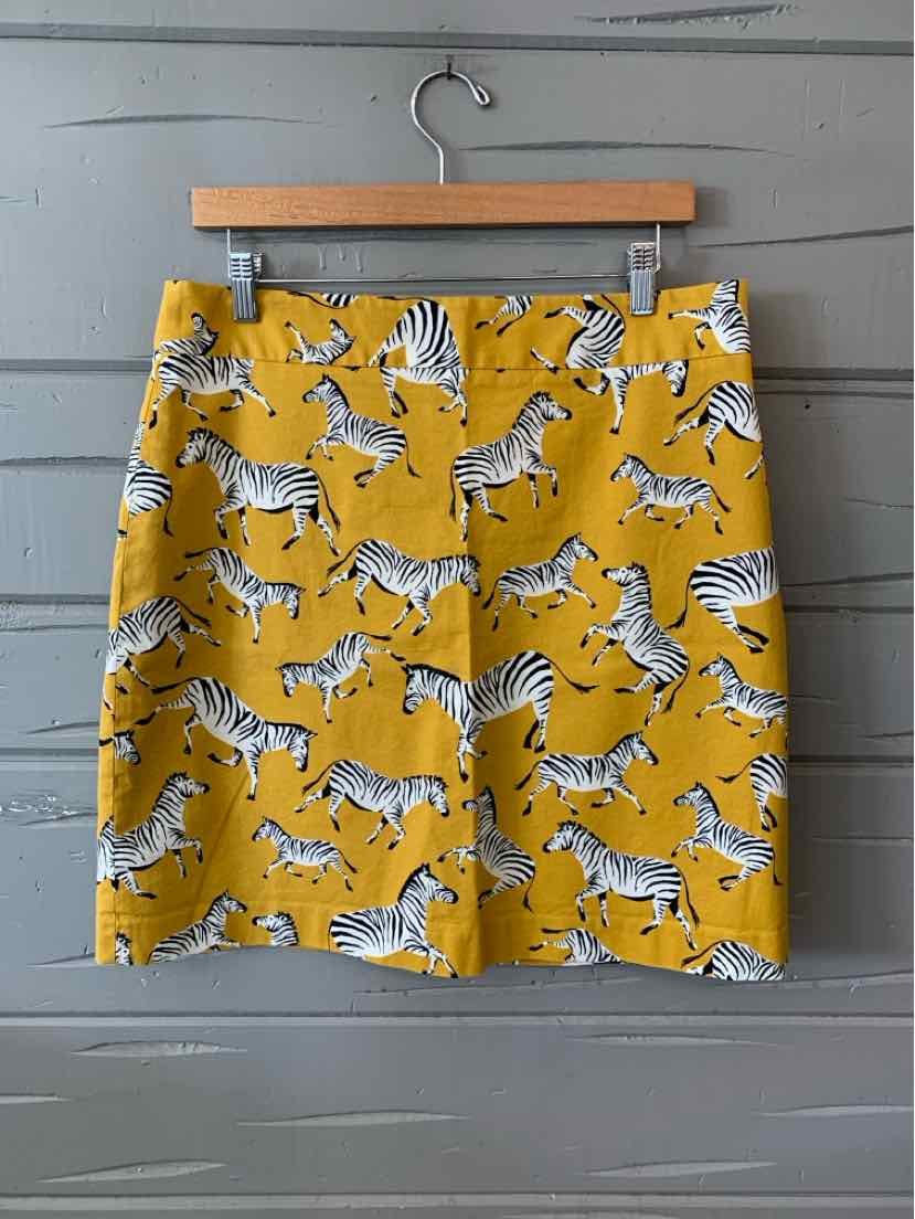 Yellow skirt with black and white zebra print, straight cut, knee-length design.