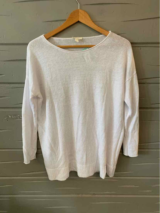 White long-sleeve lightweight knit sweater with round neckline, size XS, displayed on wooden hanger.