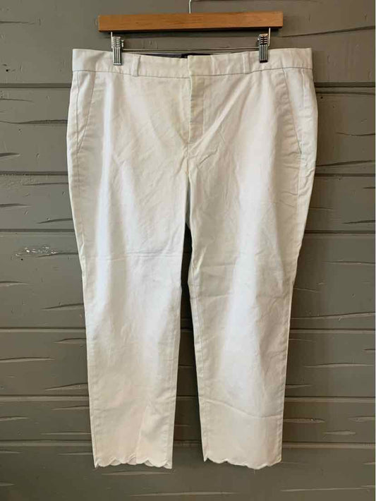 White women's ankle-length pants with scalloped hem and front pockets, size 14.