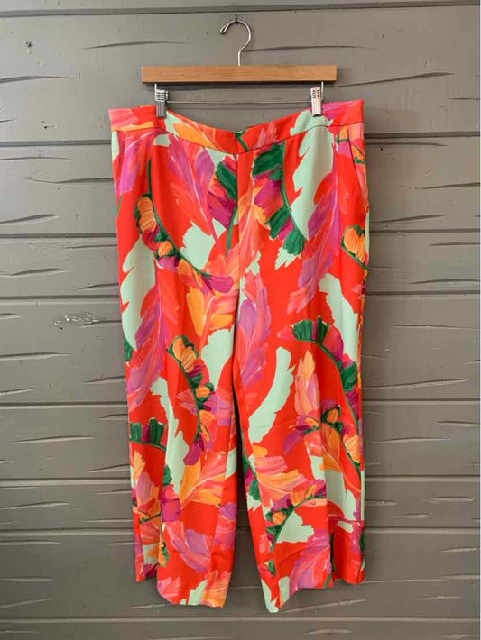 Women's colorful floral loose-fit pants with shades of red, pink, green, and orange, size 18.