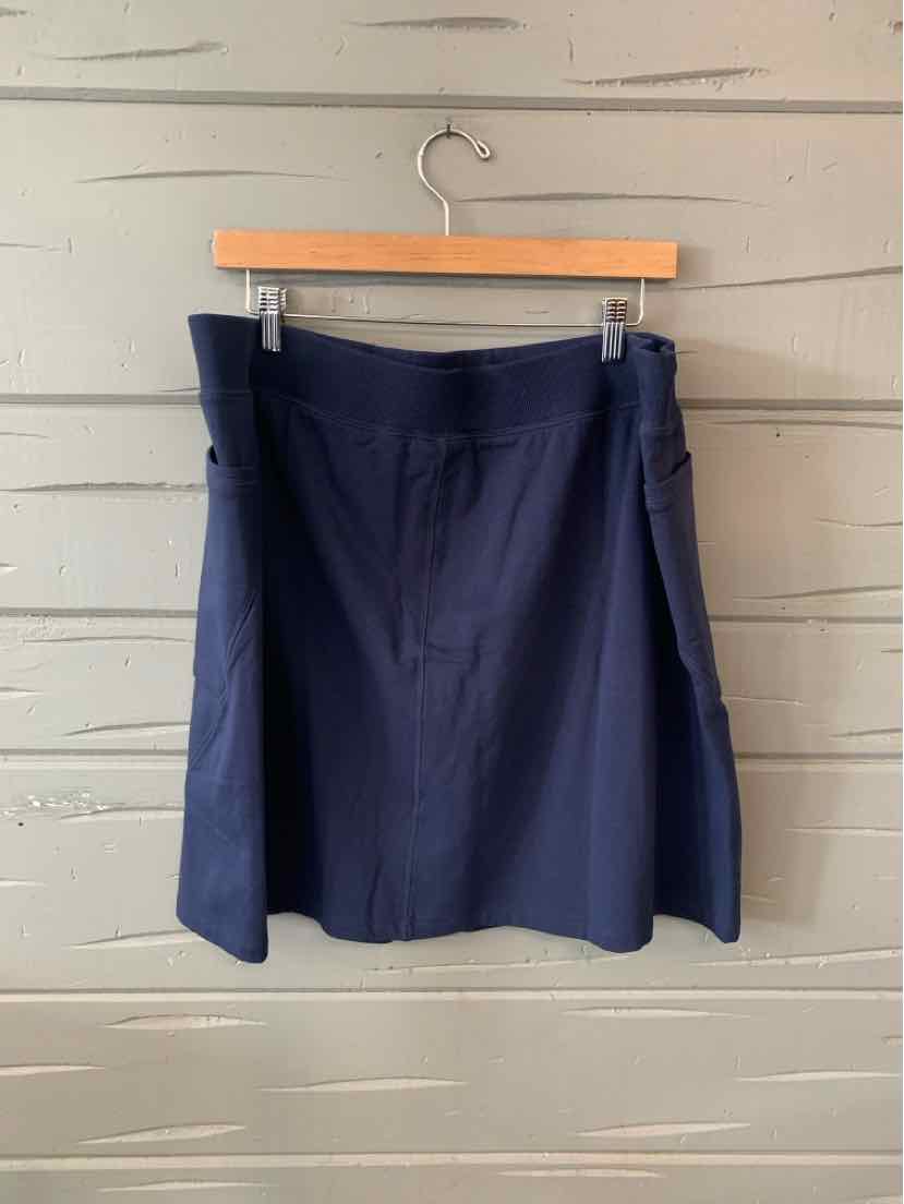 Navy blue skort with flat front and side slit details, size XL.