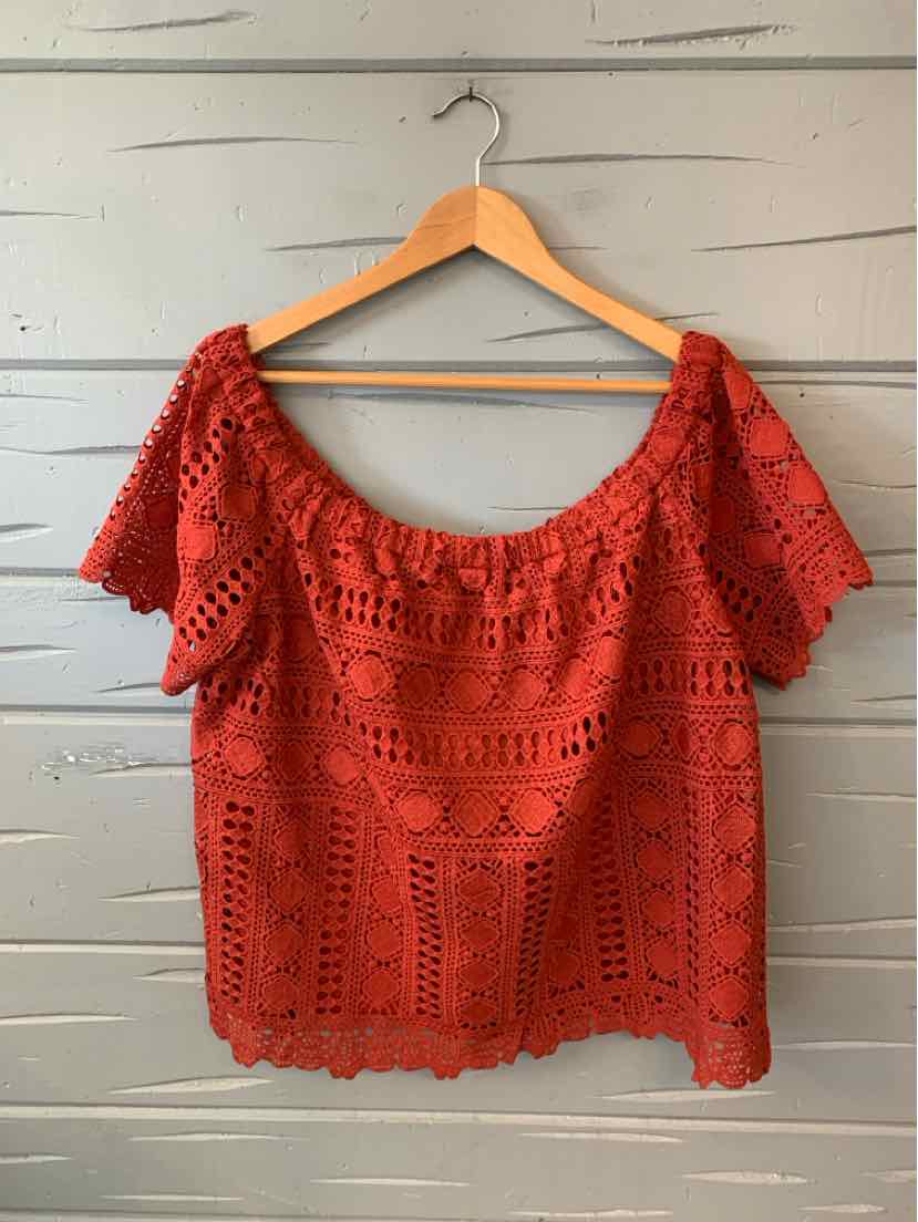 Red crochet lace blouse with wide neckline and short ruffled sleeves, size XL.