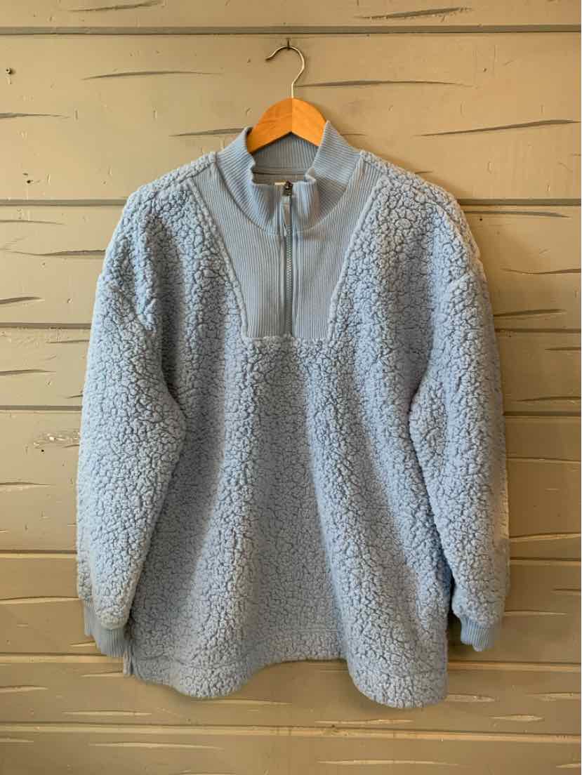 Light gray textured fleece pullover with a short stand collar, quarter-zip neckline, and long sleeves.