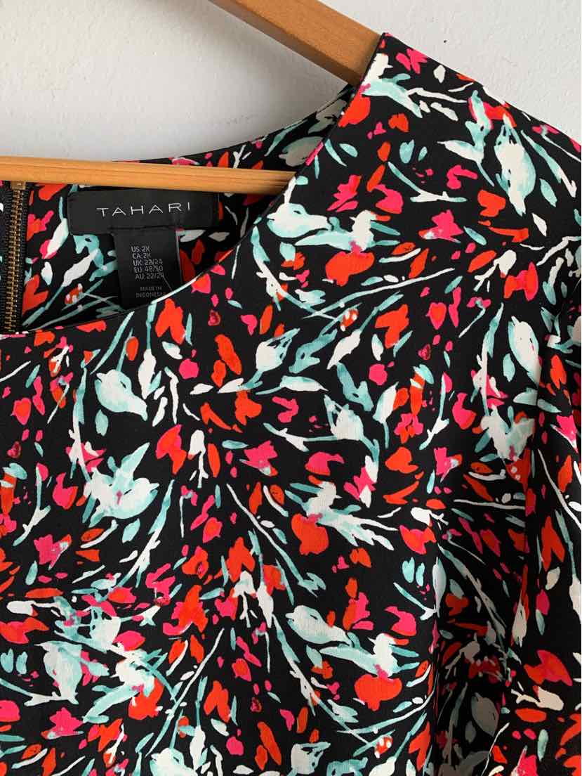 Black dress with vibrant red, blue, and white floral print and a V-neckline, size 2X.
