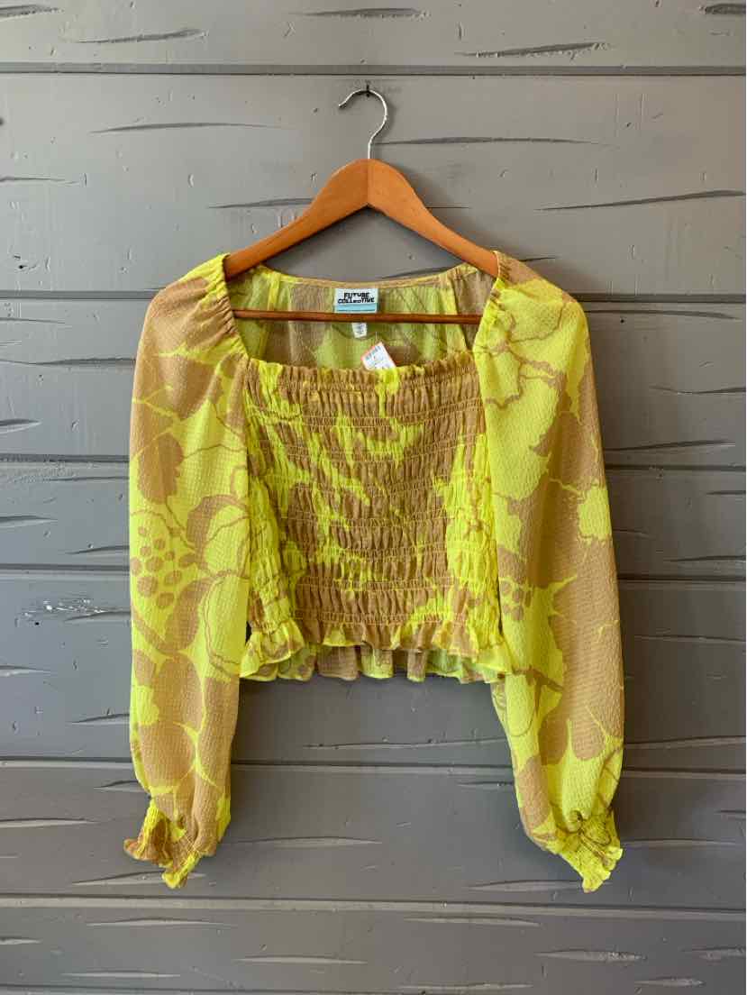 Yellow floral sheer long-sleeve cropped blouse with smocked bodice and elastic cuffs.