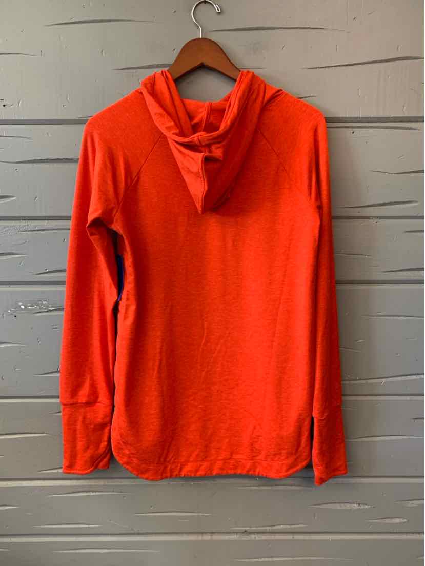 Bright red long-sleeve hoodie with thumbholes and a relaxed fit hanging on a wooden hanger.